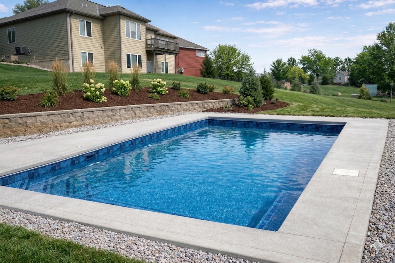 Custom pool with covered patio — Hovey Construction pool and home builder Siouxland