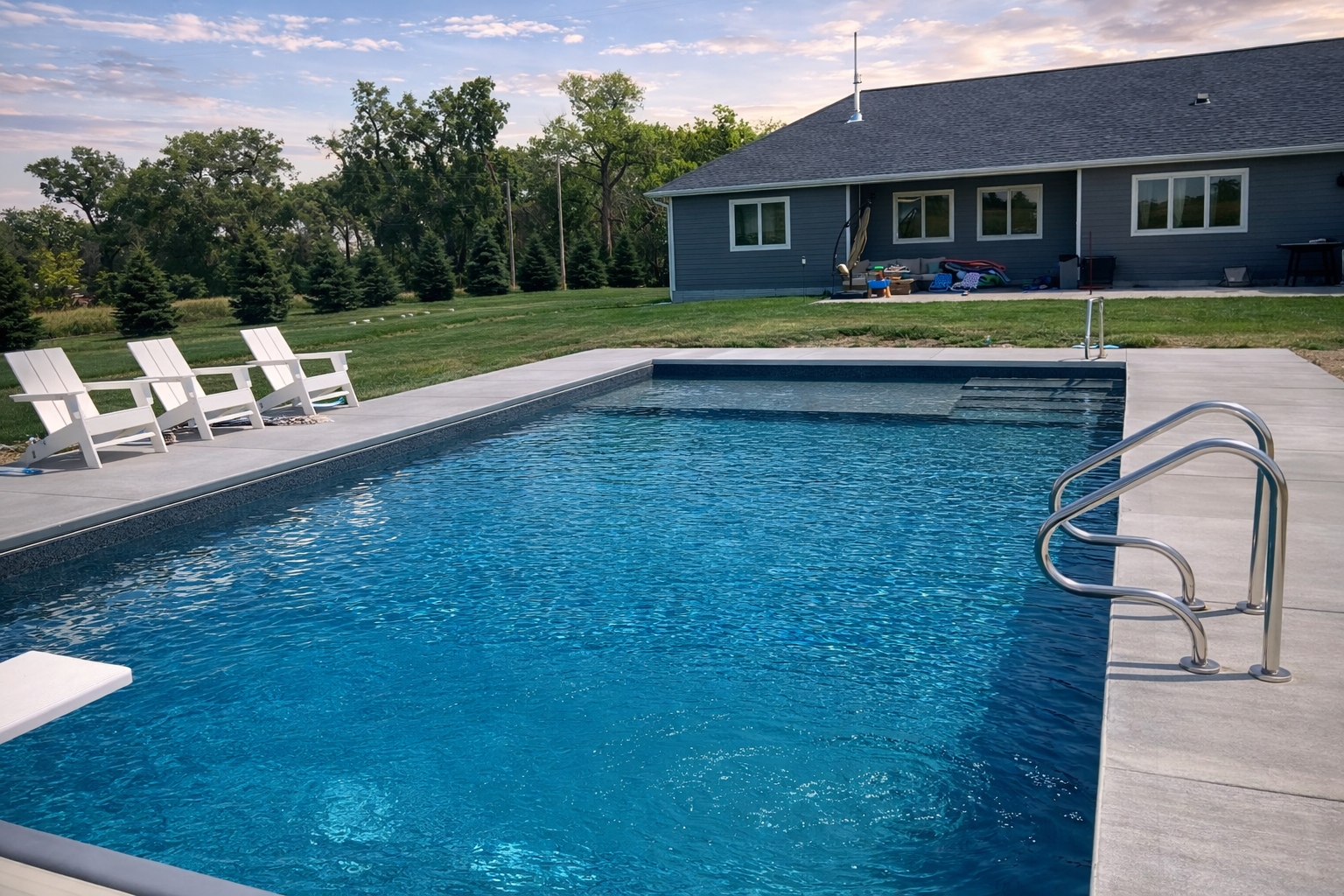 Custom pool with fountain jets and pool house — Hovey inground pool contractor Iowa Nebraska