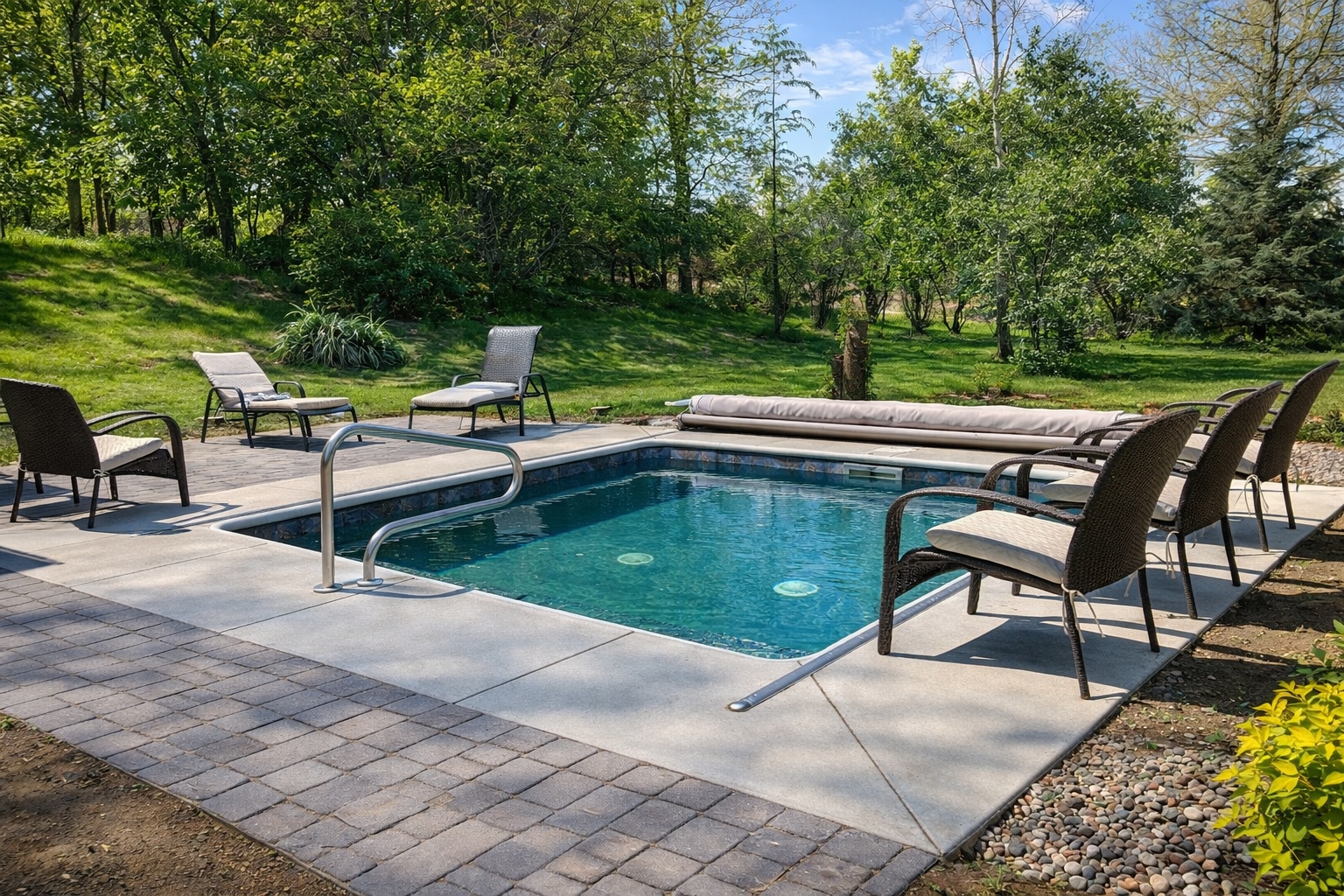 Compact inground pool with covered patio — Hovey Construction pool builder South Sioux City