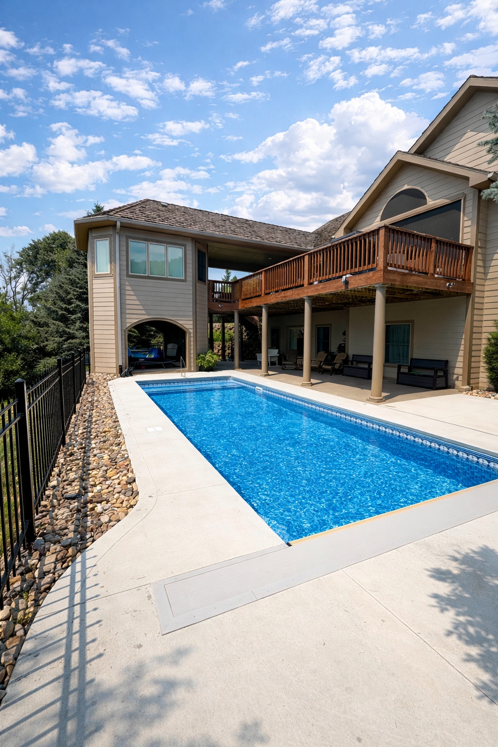 Backyard inground pool with LED night lighting — Hovey Construction pool contractor Siouxland